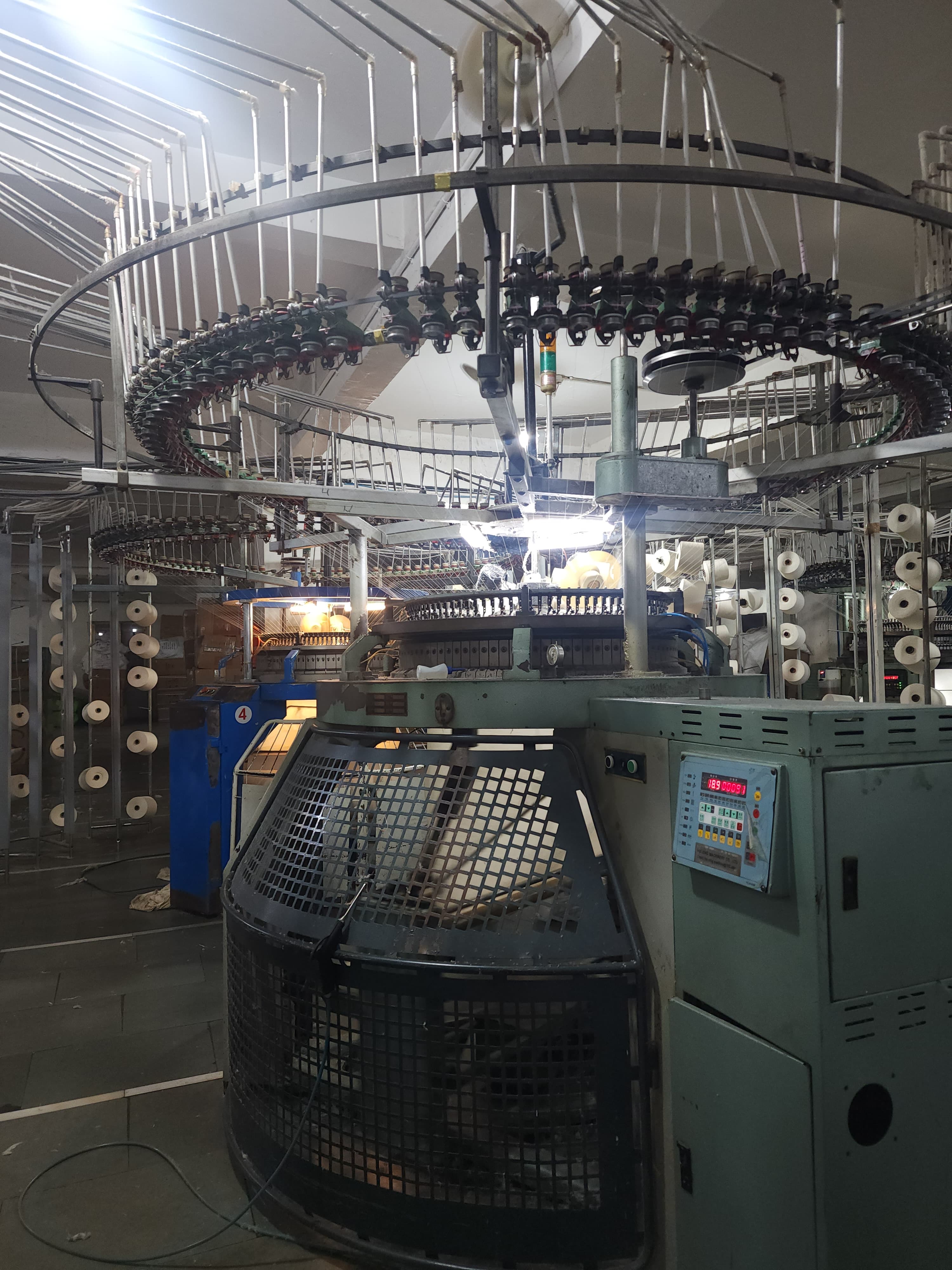 Circular knitting machine in India converting Supima cotton yarn into 180 GSM single jersey fabric for Boring Label t-shirts